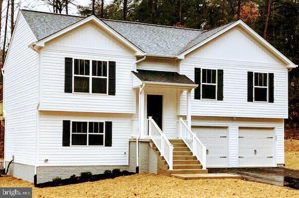 bi-level home featuring a garage