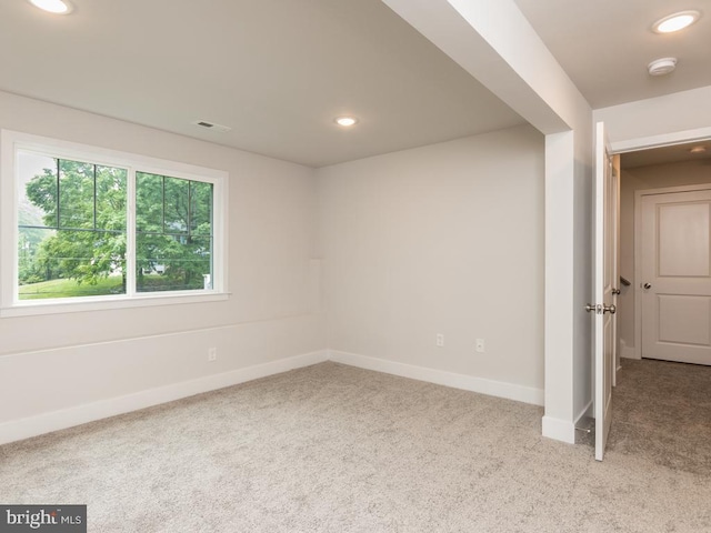 empty room featuring light colored carpet