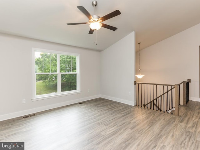 spare room featuring hardwood / wood-style flooring and ceiling fan