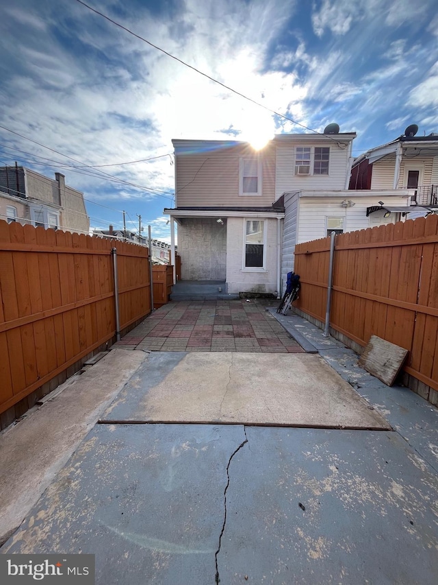 rear view of property featuring a patio area