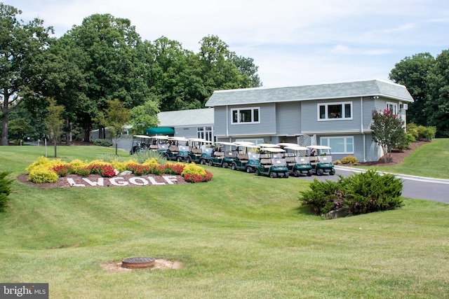 view of property's community with a yard