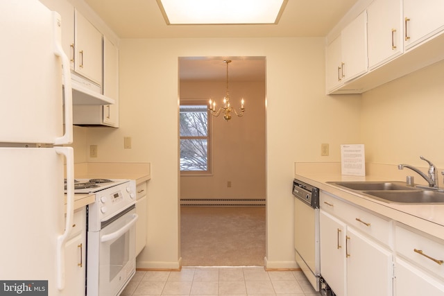 kitchen with sink, white cabinets, decorative light fixtures, and white appliances