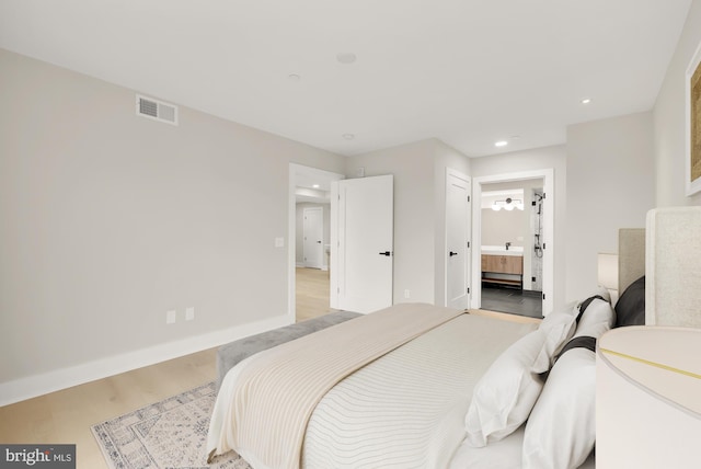 bedroom featuring ensuite bath