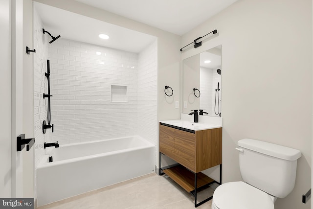 full bathroom featuring tile patterned floors, vanity, toilet, and tiled shower / bath