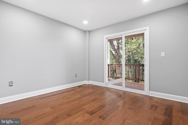 unfurnished room featuring wood-type flooring