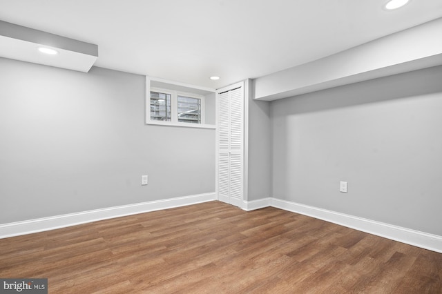 basement featuring hardwood / wood-style flooring