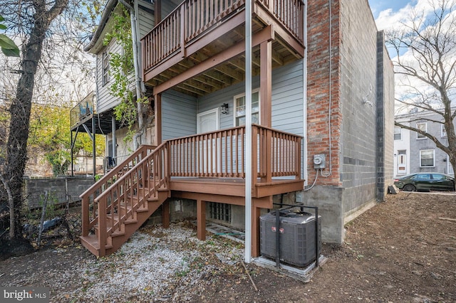 back of house featuring central air condition unit