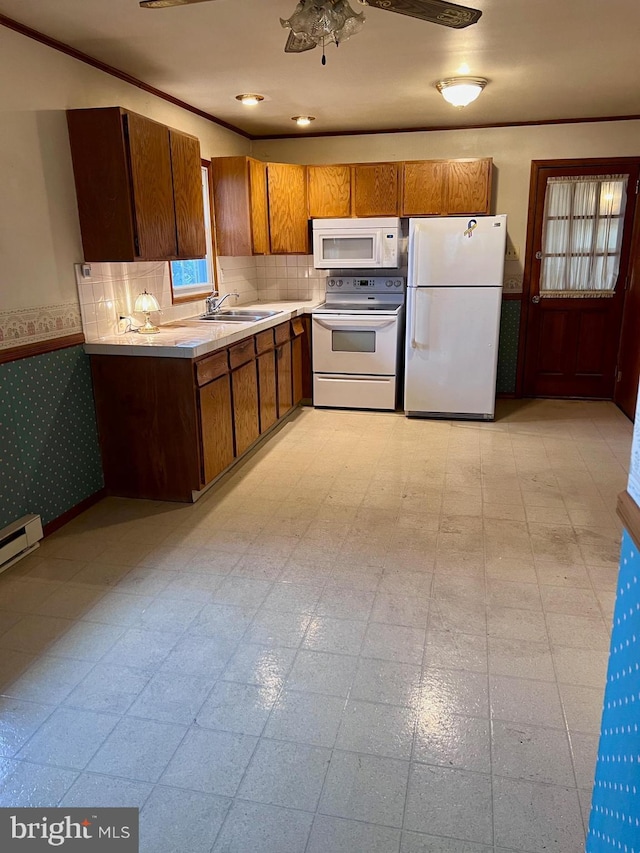 kitchen with ceiling fan, sink, and white appliances