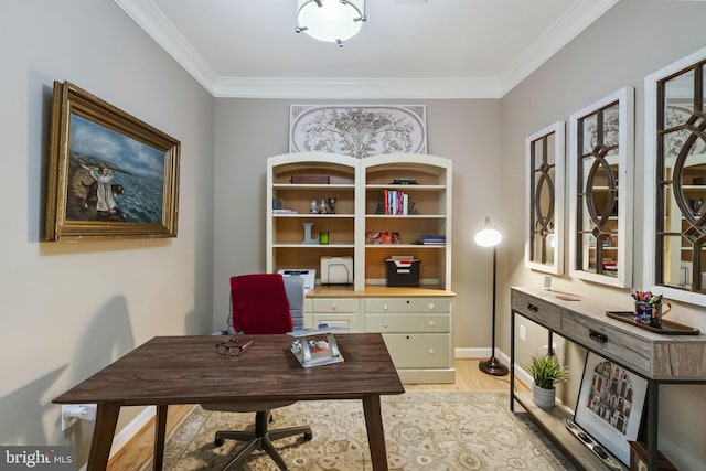 office area featuring light wood-type flooring and crown molding