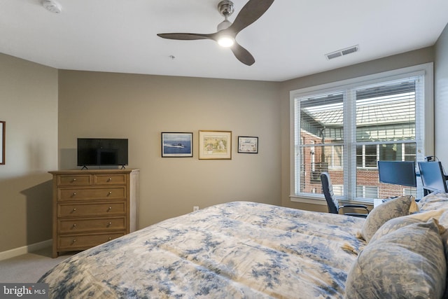 bedroom with ceiling fan and light colored carpet