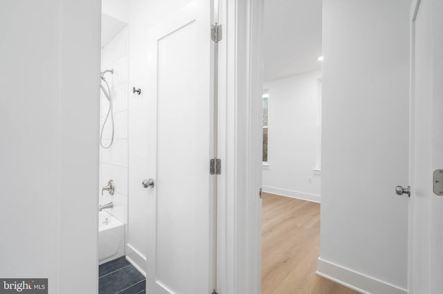 1401 S 13th St, Philadelphia, PA 19147 - bathroom featuring tub / shower combination, baseboards, and wood finished floors