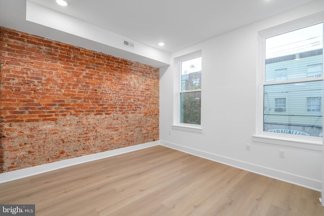 1401 S 13th St, Philadelphia, PA 19147 - spare room featuring baseboards, light wood-style flooring, brick wall, and recessed lighting