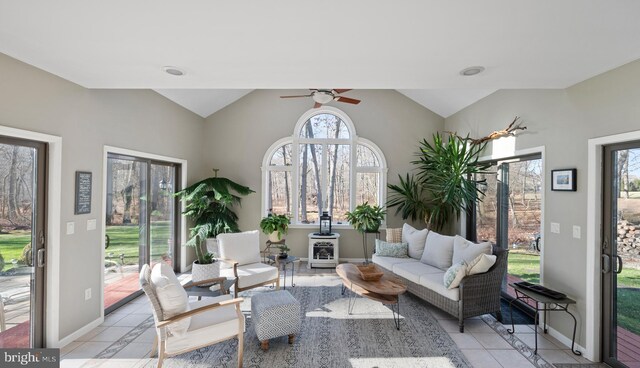 tiled living room with ceiling fan