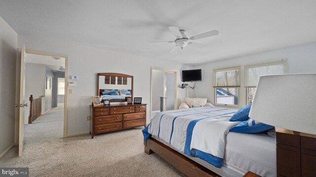 carpeted bedroom with ceiling fan