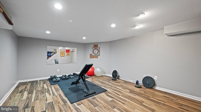 workout room featuring hardwood / wood-style flooring