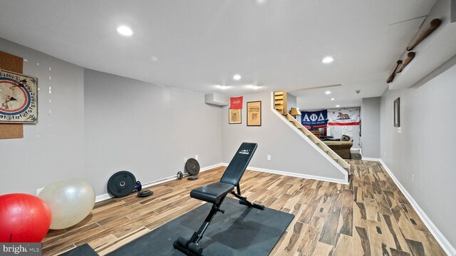 exercise room featuring hardwood / wood-style flooring