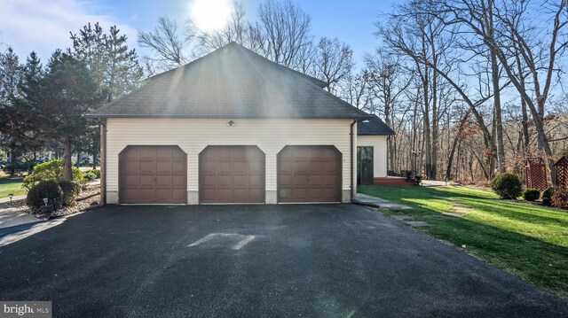 view of side of property with a yard