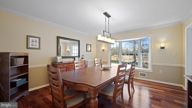 dining room featuring crown molding and dark wood-type flooring