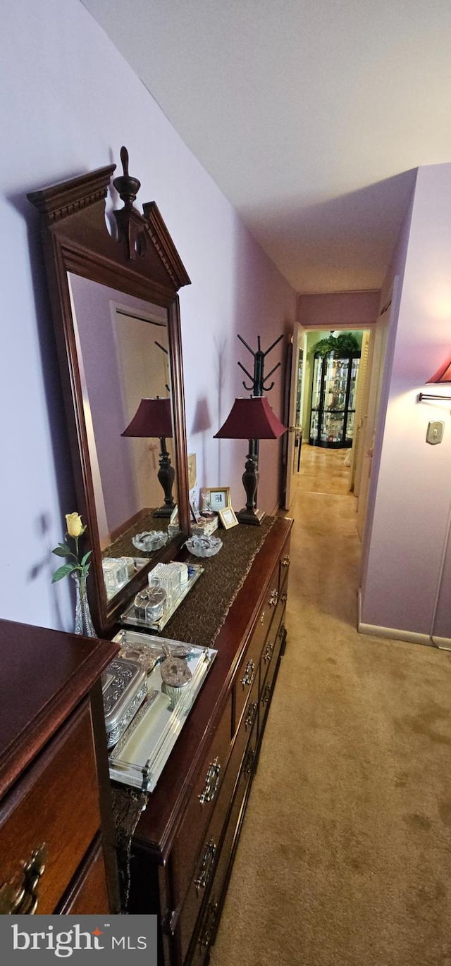 corridor with light colored carpet