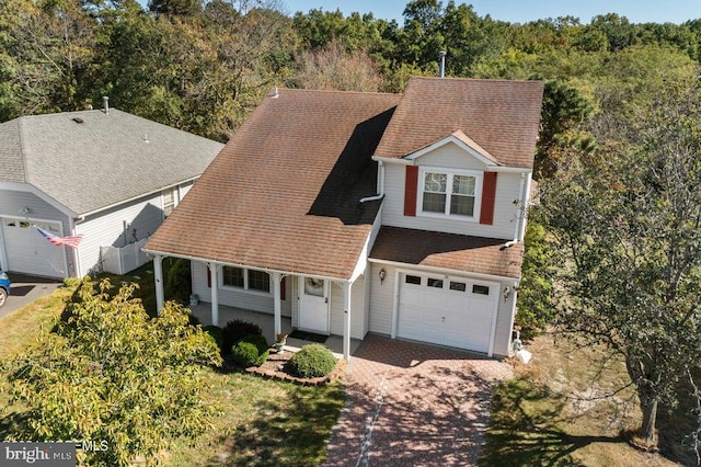 view of front of house with a porch and a garage