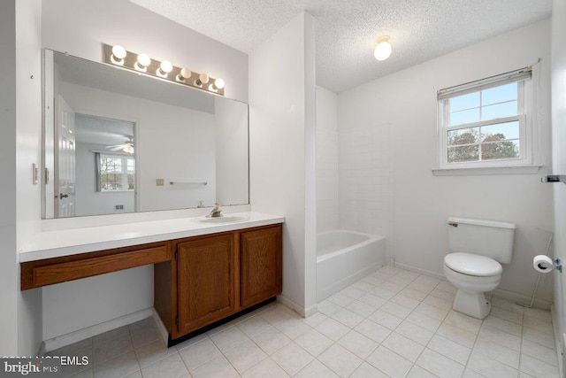 bathroom featuring tile patterned floors, ceiling fan, a textured ceiling, and toilet