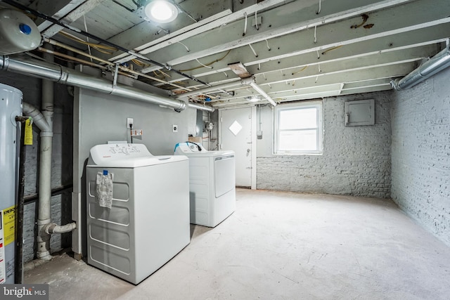 basement with separate washer and dryer, water heater, and electric panel