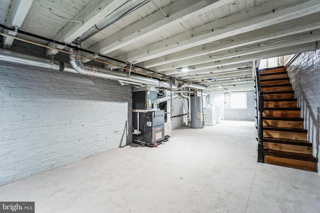 basement with gas water heater and heating unit