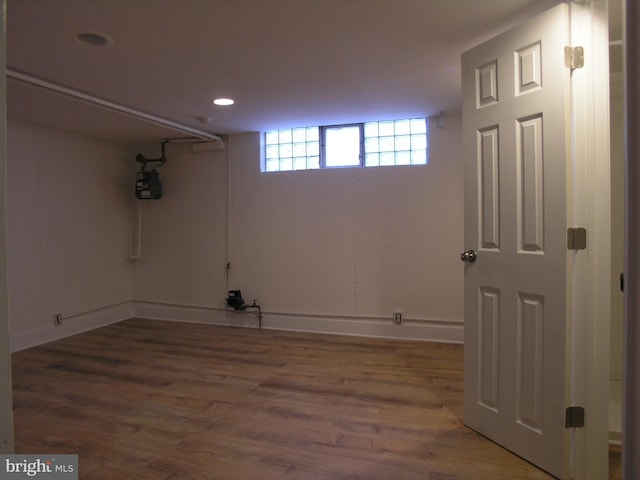 basement featuring dark wood-type flooring