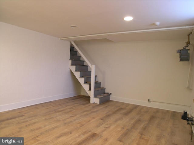 basement featuring light hardwood / wood-style floors