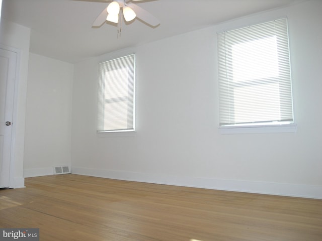 unfurnished room with light hardwood / wood-style floors and ceiling fan