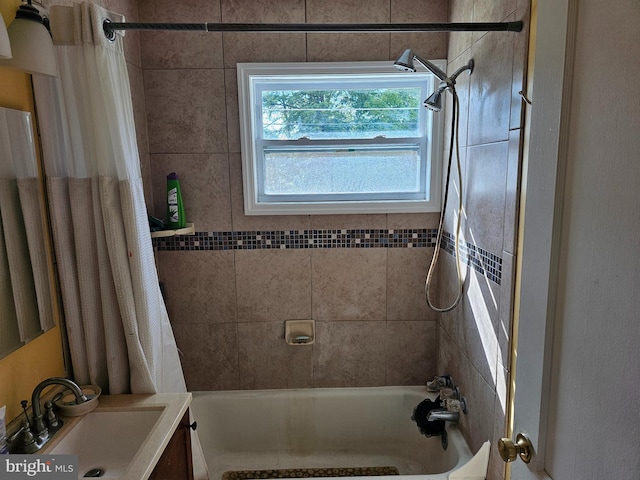 bathroom with sink and shower / tub combo with curtain