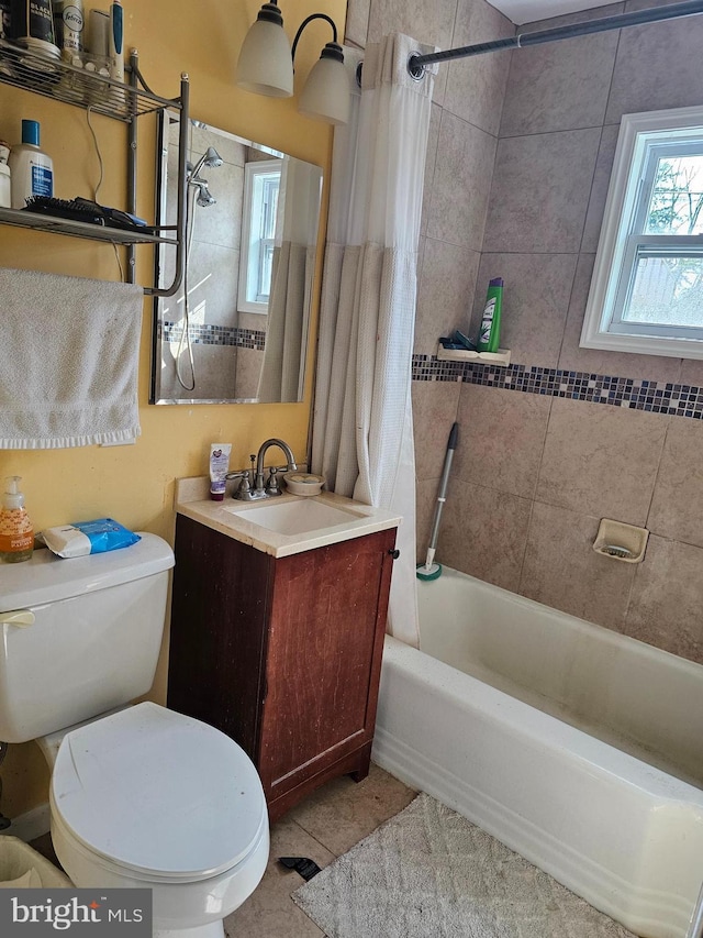 full bathroom with tile patterned flooring, shower / bath combo, toilet, and vanity