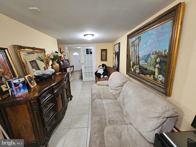 tiled living room featuring french doors