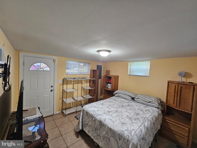 bedroom featuring light tile patterned floors