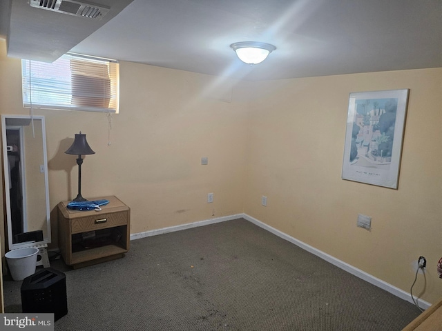 basement with dark carpet