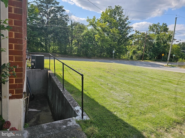 view of yard with central AC unit