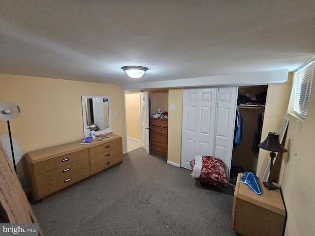 carpeted bedroom with a closet