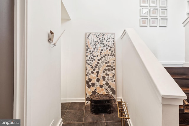 staircase with tile patterned floors