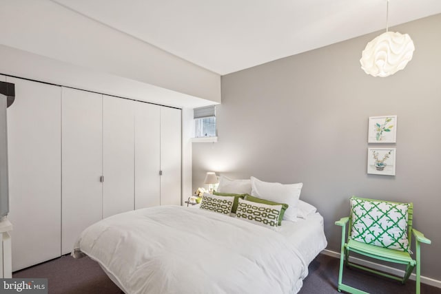 carpeted bedroom with a closet