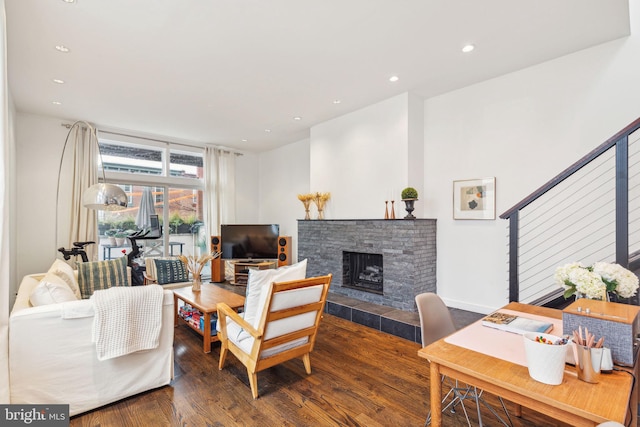 living room featuring hardwood / wood-style flooring and a fireplace