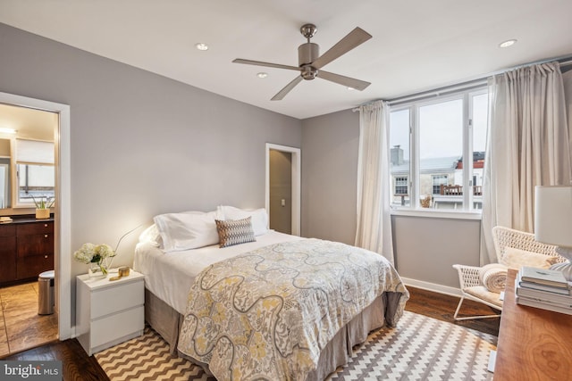 bedroom with ceiling fan and light hardwood / wood-style flooring