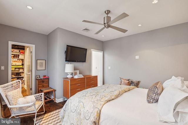 bedroom with dark wood-type flooring and ceiling fan