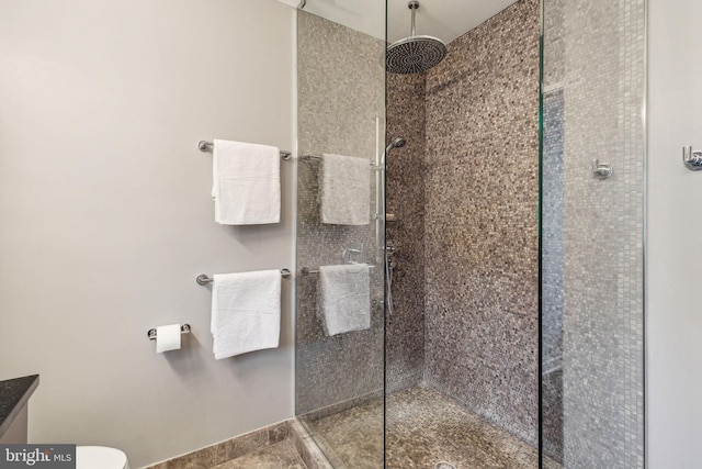 bathroom with tiled shower