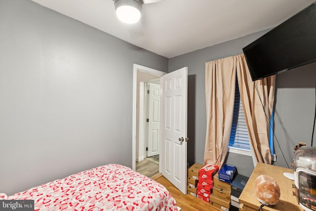 bedroom with hardwood / wood-style flooring and ceiling fan