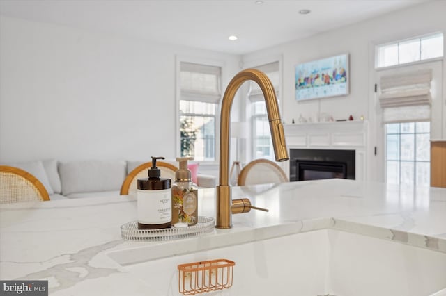 kitchen featuring light stone countertops