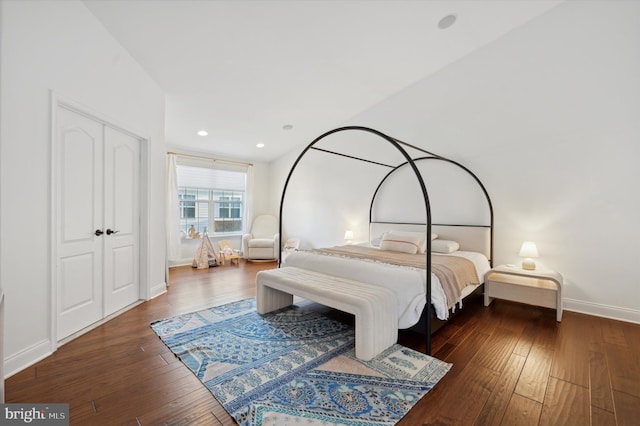 bedroom with a closet and dark hardwood / wood-style flooring