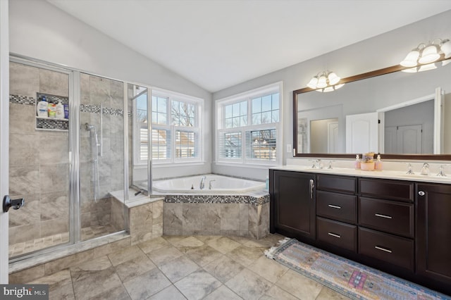 bathroom with tile patterned flooring, vanity, independent shower and bath, and lofted ceiling