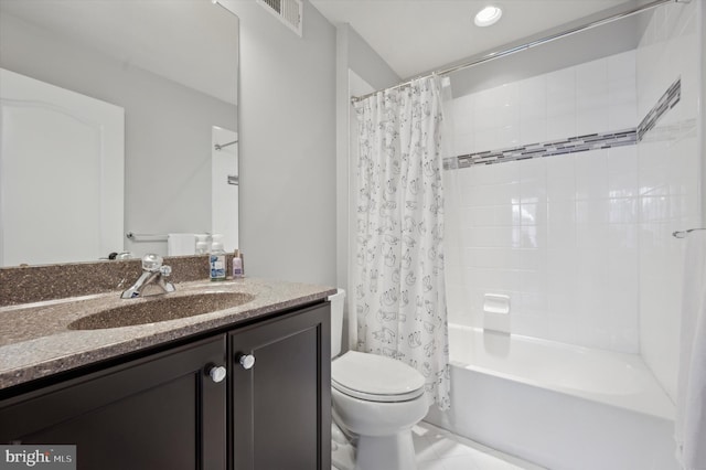 full bathroom with tile patterned flooring, vanity, shower / tub combo, and toilet