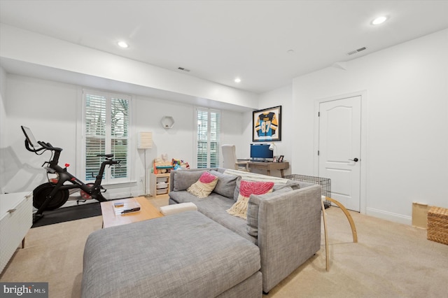 living room with light carpet and a wealth of natural light