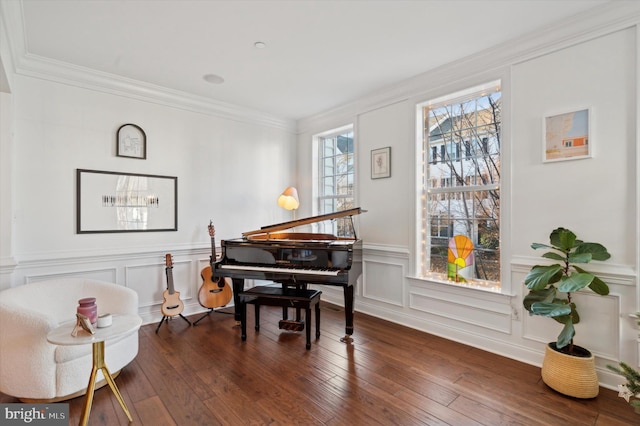 sitting room featuring dark hardwood / wood-style flooring and ornamental molding